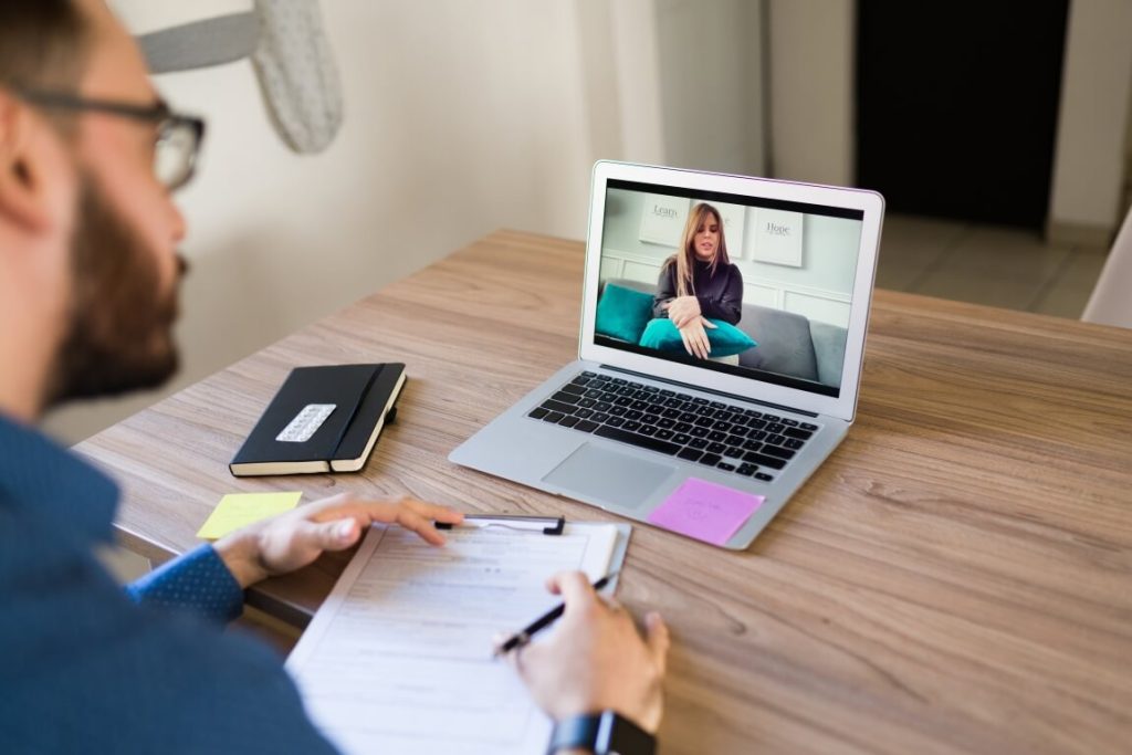 Therapist talking with a patient online